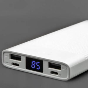 Powerbank for charging mobile devices closeup on black.